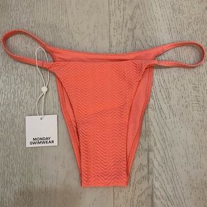 Monday swimwear bikini bottom in color pink. Size medium. Has never been worn.